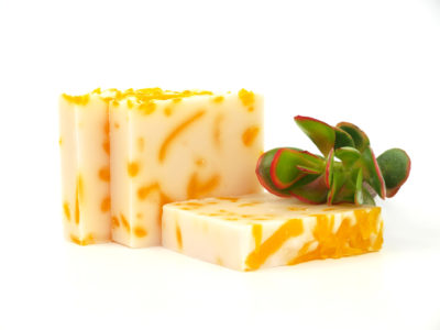 orange and cream soaps with plant