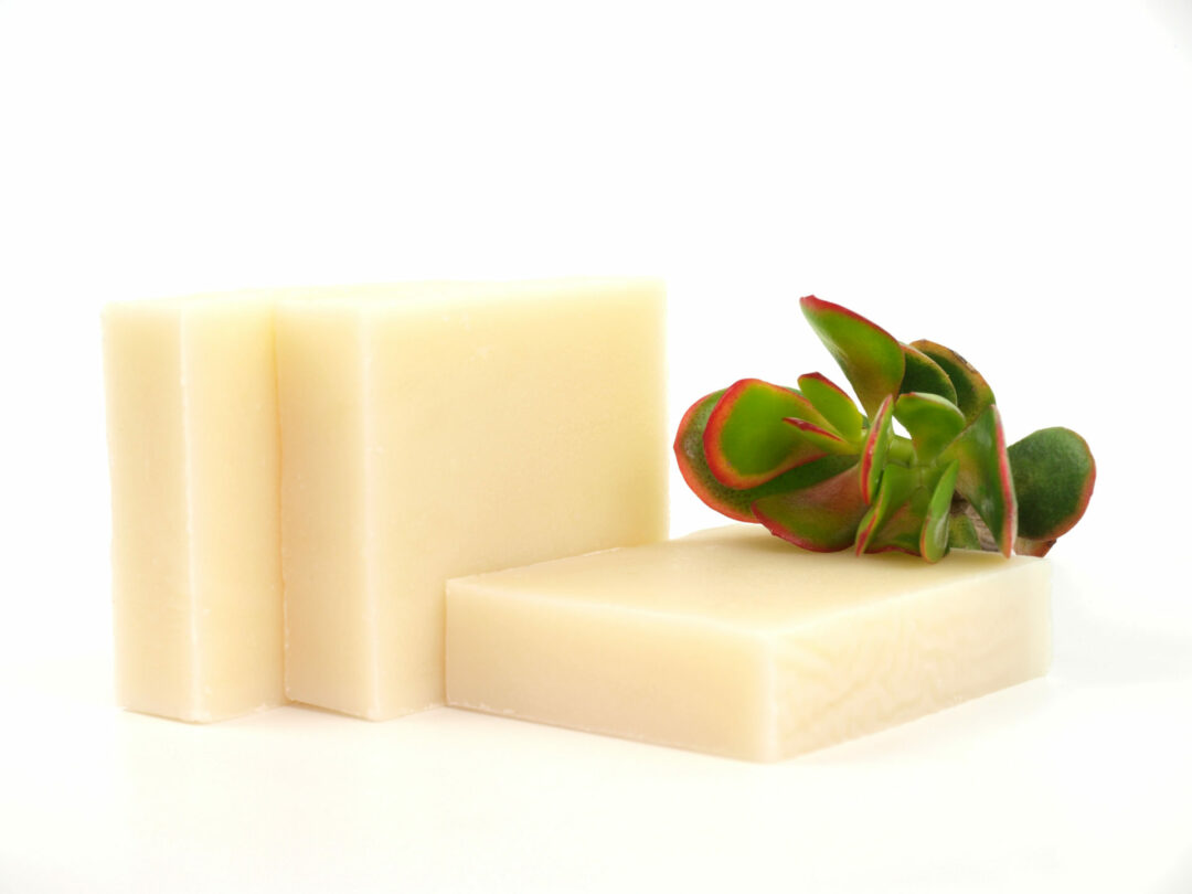 three soaps with plant