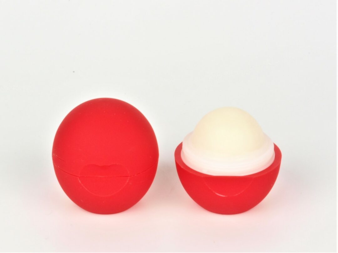 red organic lip balm ball open