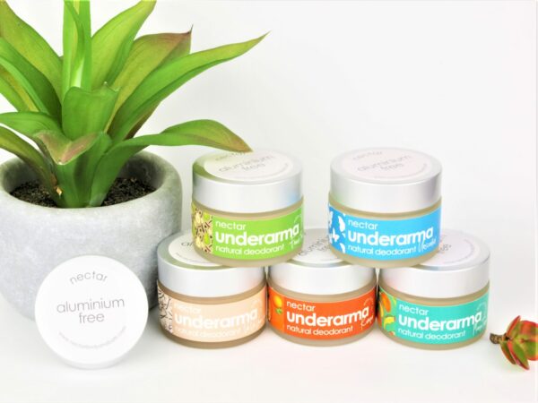 mixed jars of deodorants with plant