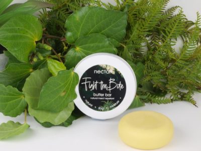 insect repellant bar in travel tin and leaves
